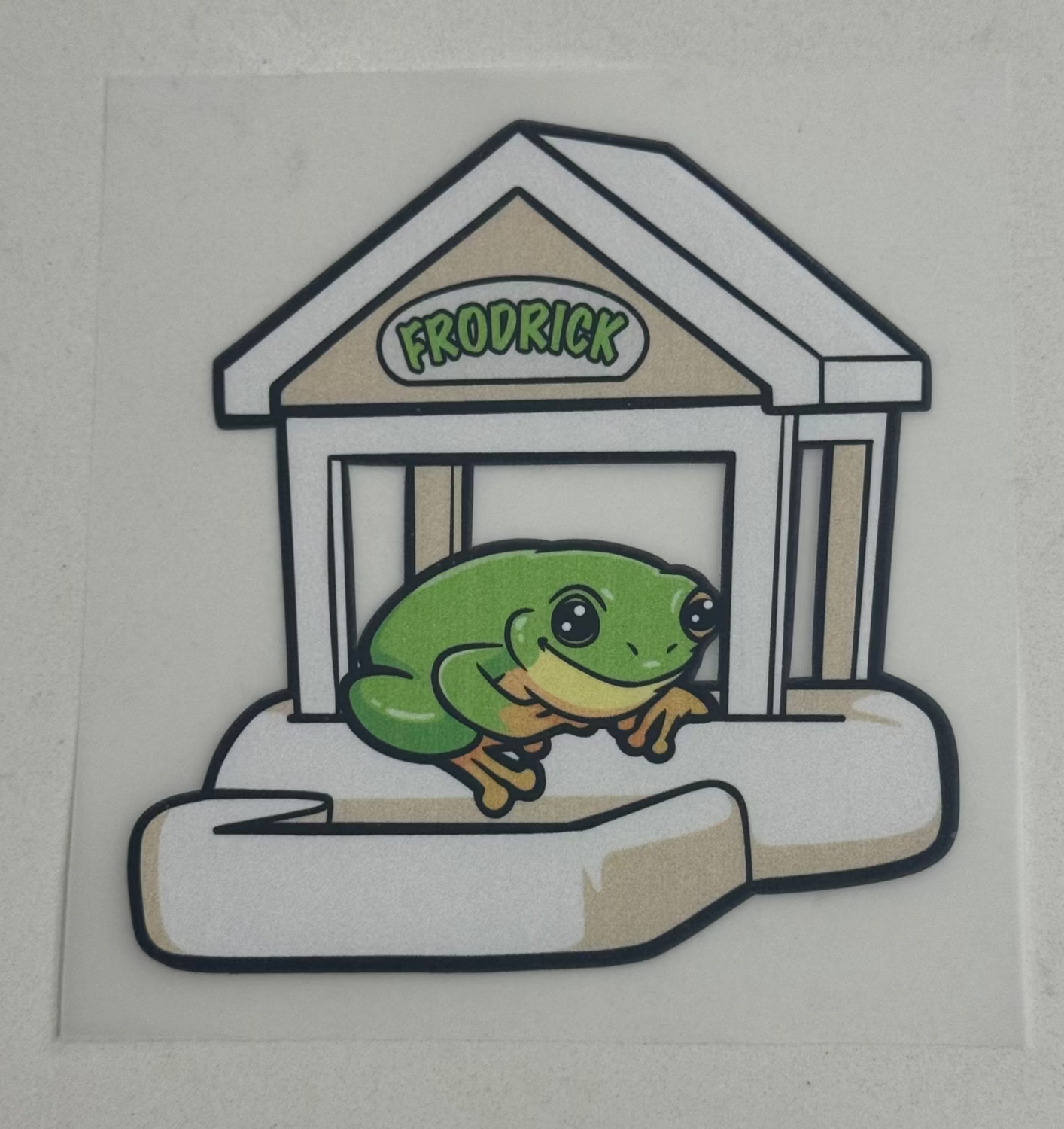Sticker of a green frog character named Frodrick on a transparent background